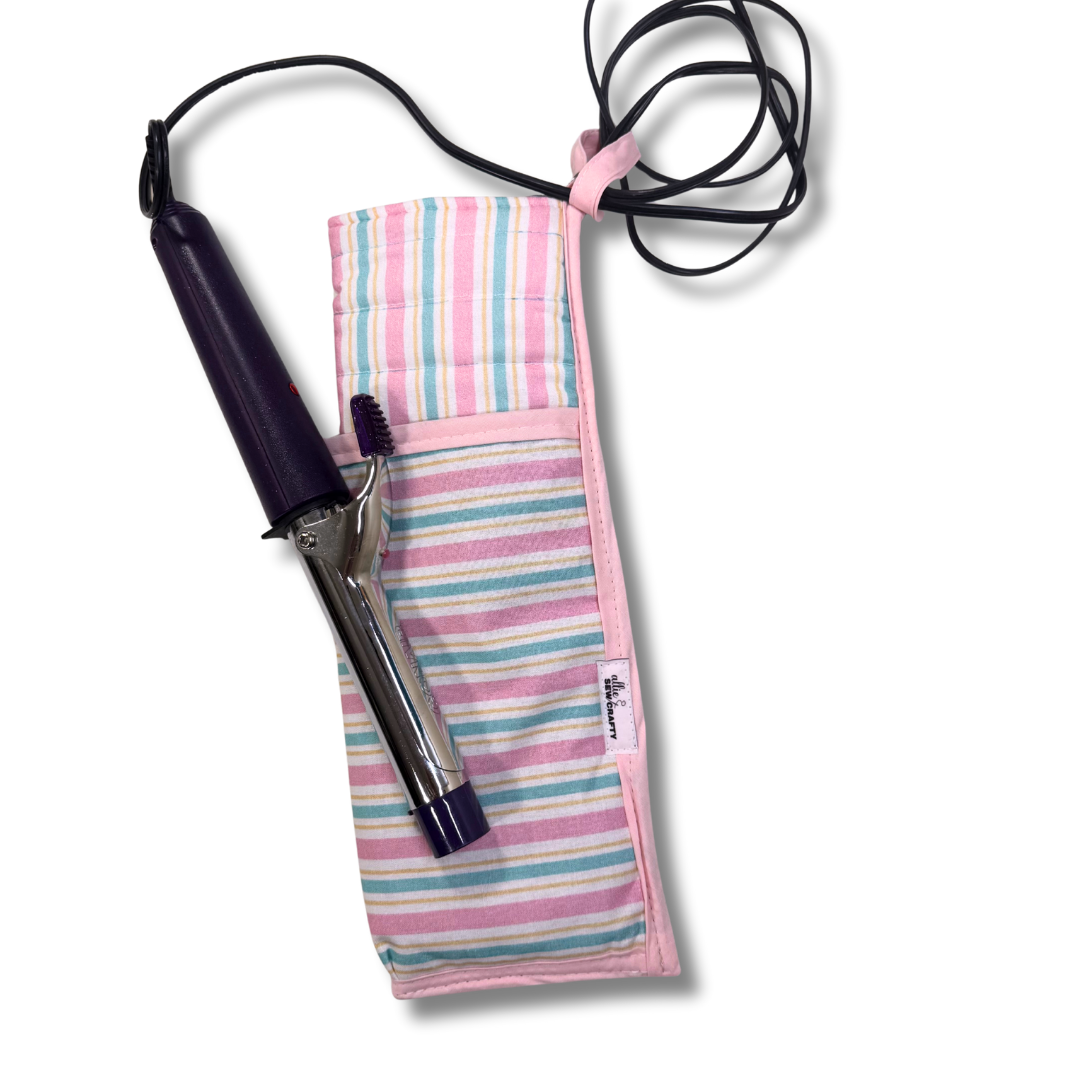 Hair straightener with a striped cover on a white background