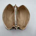 Heart-shaped pouch with floral zipper on a white background