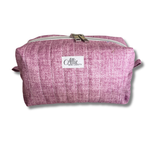 A mauve quilted fabric cosmetic pouch with a white brand label reading 'Allie Sew Crafty' on a white background.