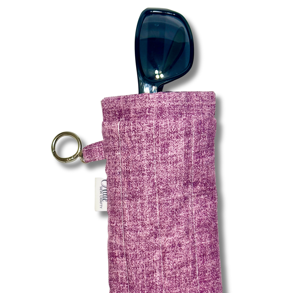 Plum heathered pouch with black sunglasses in a white background