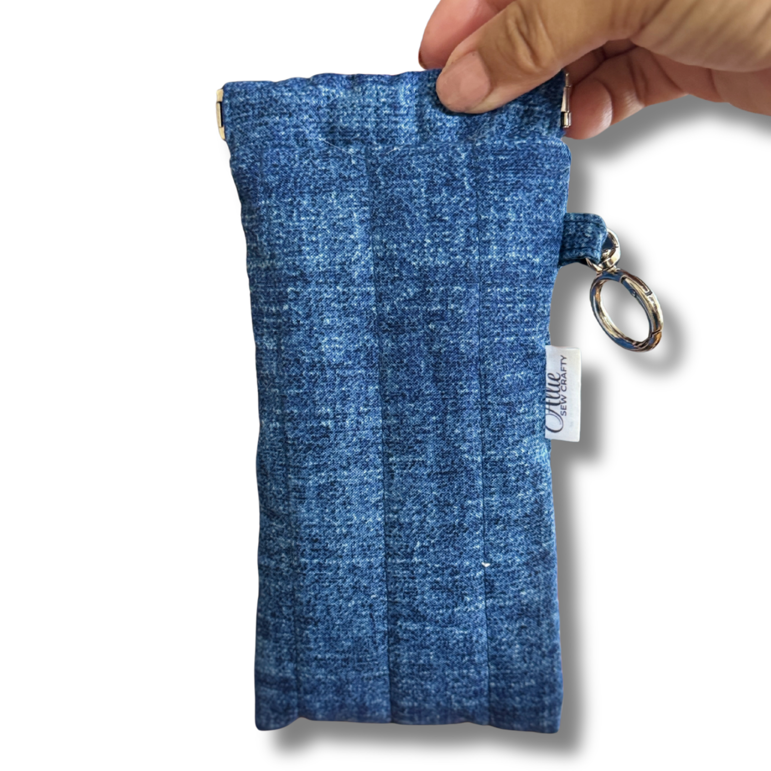 A blue denim-textured sunglasses pouch, on a white background.