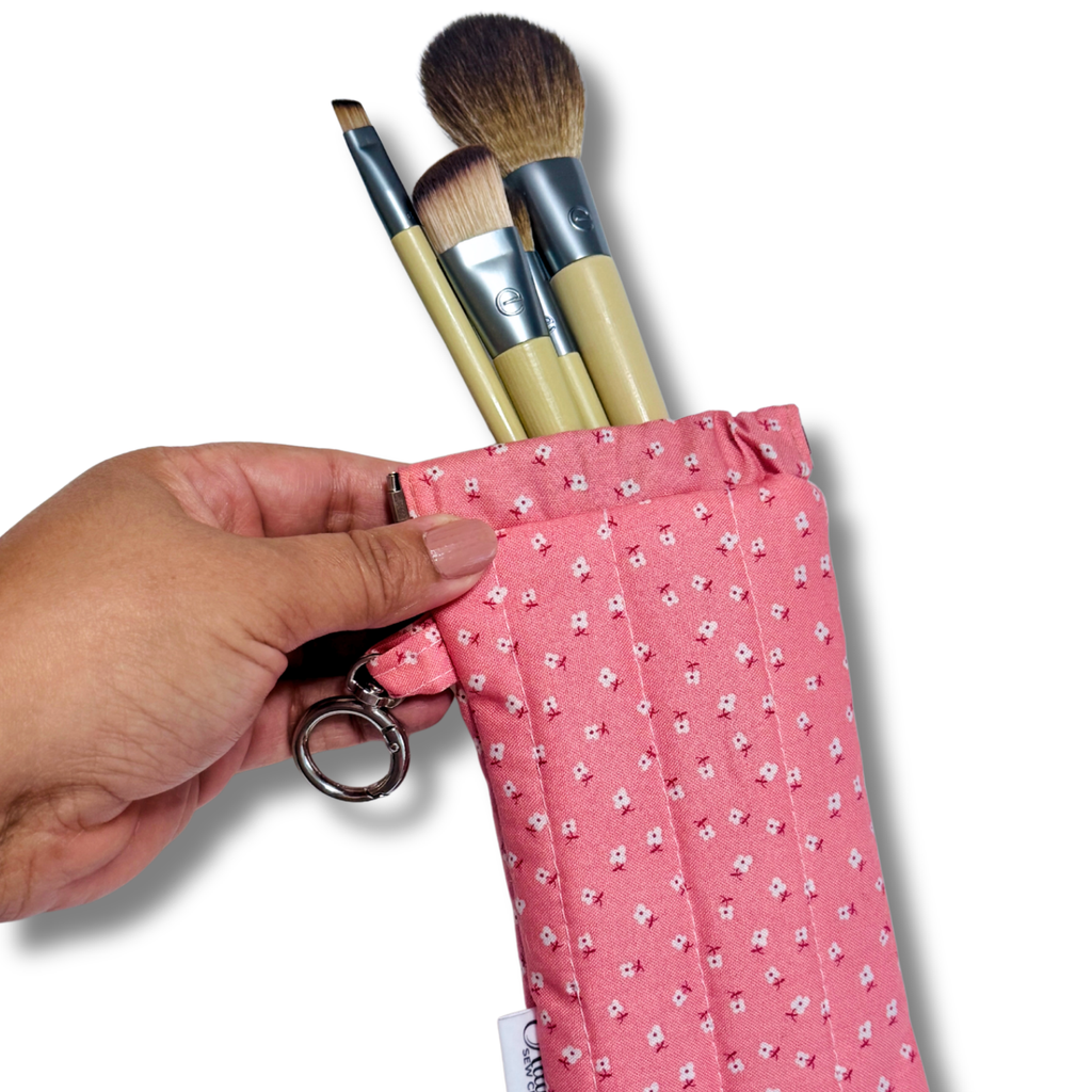 Pink Dainty Daisies quilted Flexi Frame Pouch filled with makeup brushes