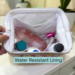 Small bag with cosmetic items and 'Water Resistant Lining' text