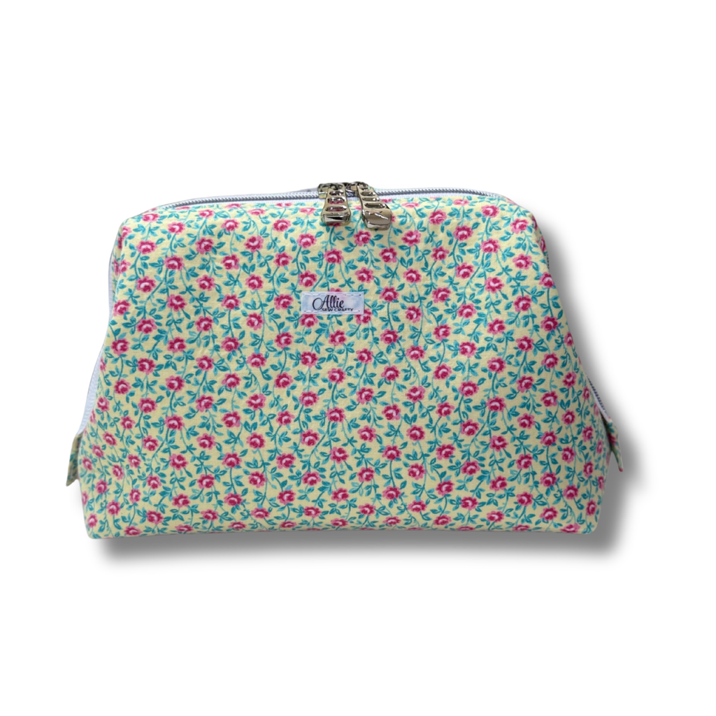Floral patterned pouch with a visible brand logo on a white background