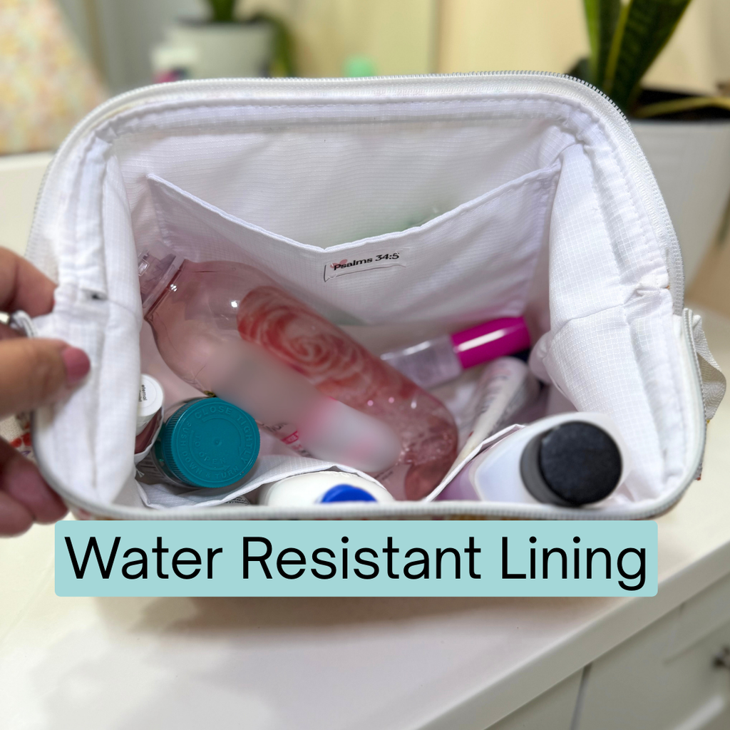 White toiletry bag with water-resistant lining containing various items.
