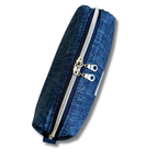 A blue denim pouch with dual silver metal zippers and silver zipper pulls, shown on a plain white background.