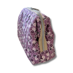A lavender purple floral zippered pouch with a beige zipper pull, shown on a white background with a soft drop shadow.