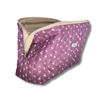 A quilted cosmetic pouch in dusty purple with a white floral pattern, featuring a beige interior lining and a silver zipper, shown on a white background.