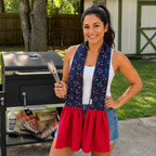 hispanic woman wearing scarf towel holding grilling tongs and standing in front of grill