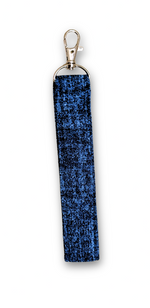 A rectangular blue textured fabric wrist strap or keychain accessory with a silver-tone metal lobster clasp at the top, shown on a plain white background.